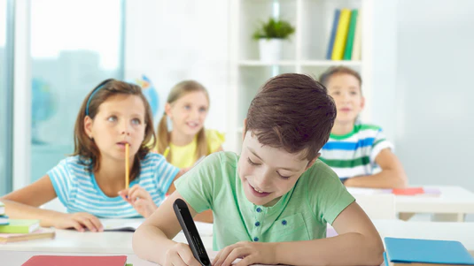Student using a standalone reading pen accommodation during independent classwork